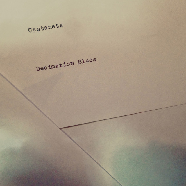 Album cover for Decimation Blues by Castanets, featuring beige dominant palette and typographic composition.